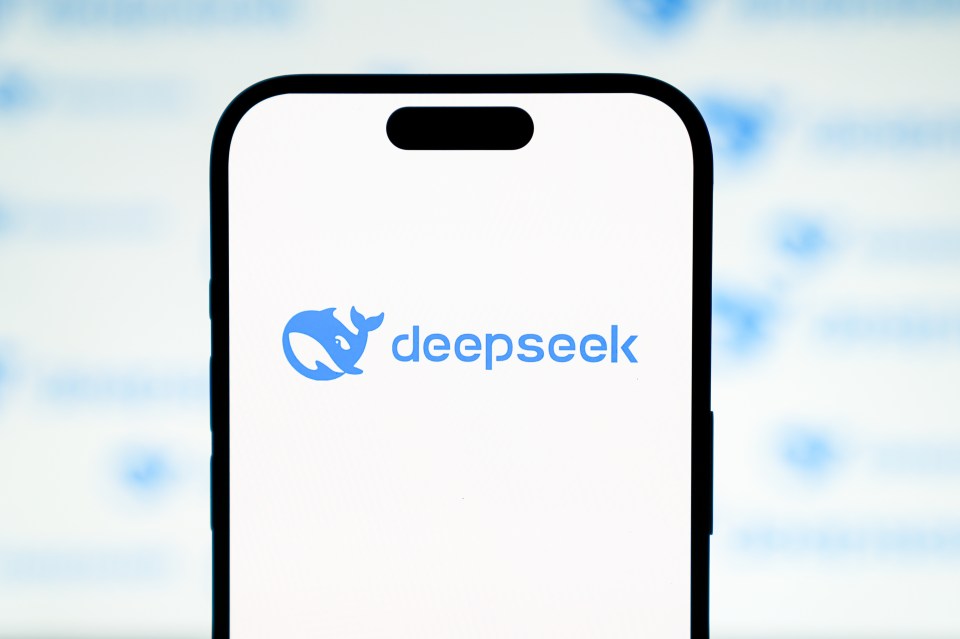 Photo illustration of a phone displaying the DeepSeek AI chatbot.