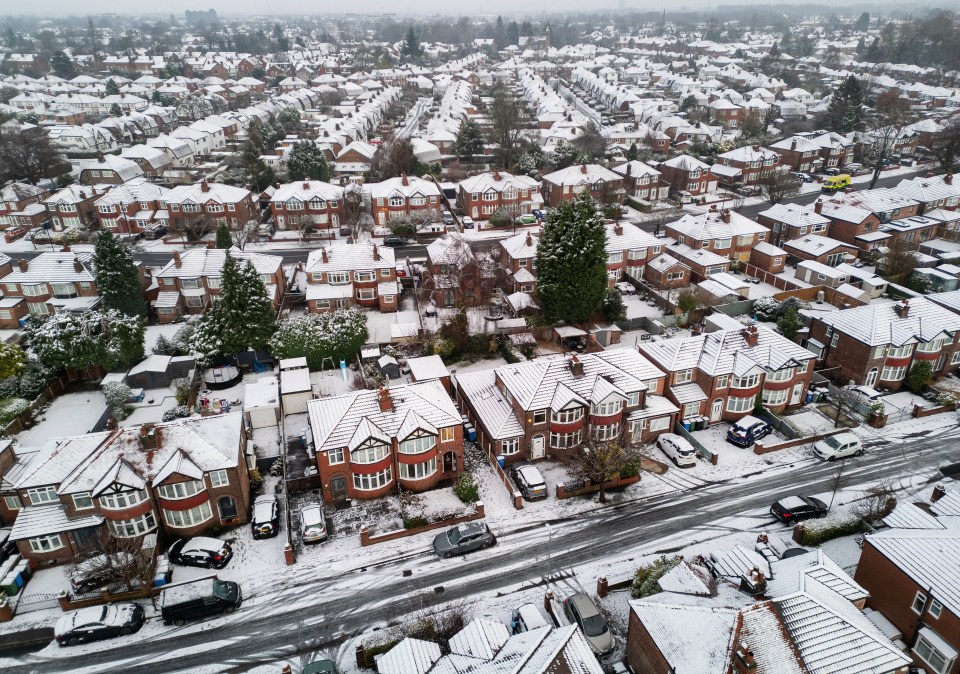 Aerial view of a snow-covered residential neighborhood.