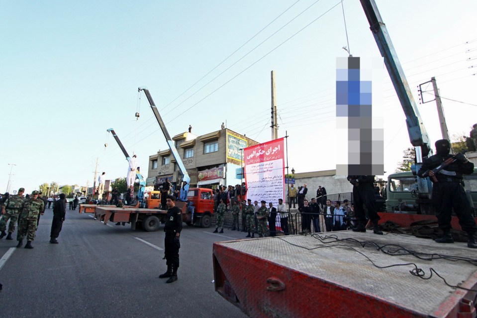 Public hanging of three men convicted of armed robbery, kidnapping, and murder of two policemen in Shiraz, Iran.