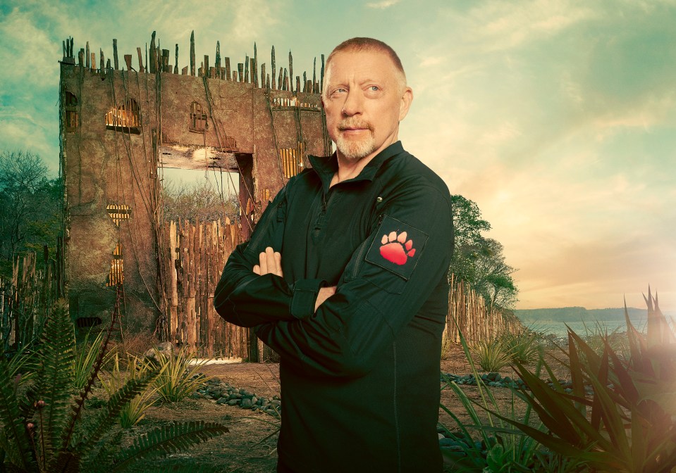 Boris Becker in front of a rustic gate, arms crossed.