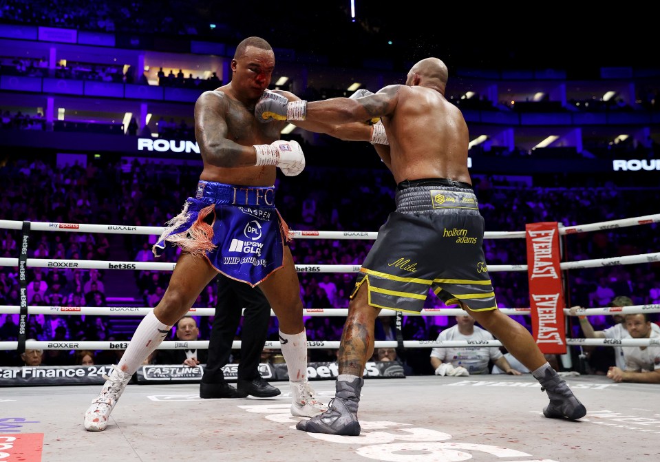 Boxers Fabio Wardley and Frazer Clarke exchanging punches in a boxing match.