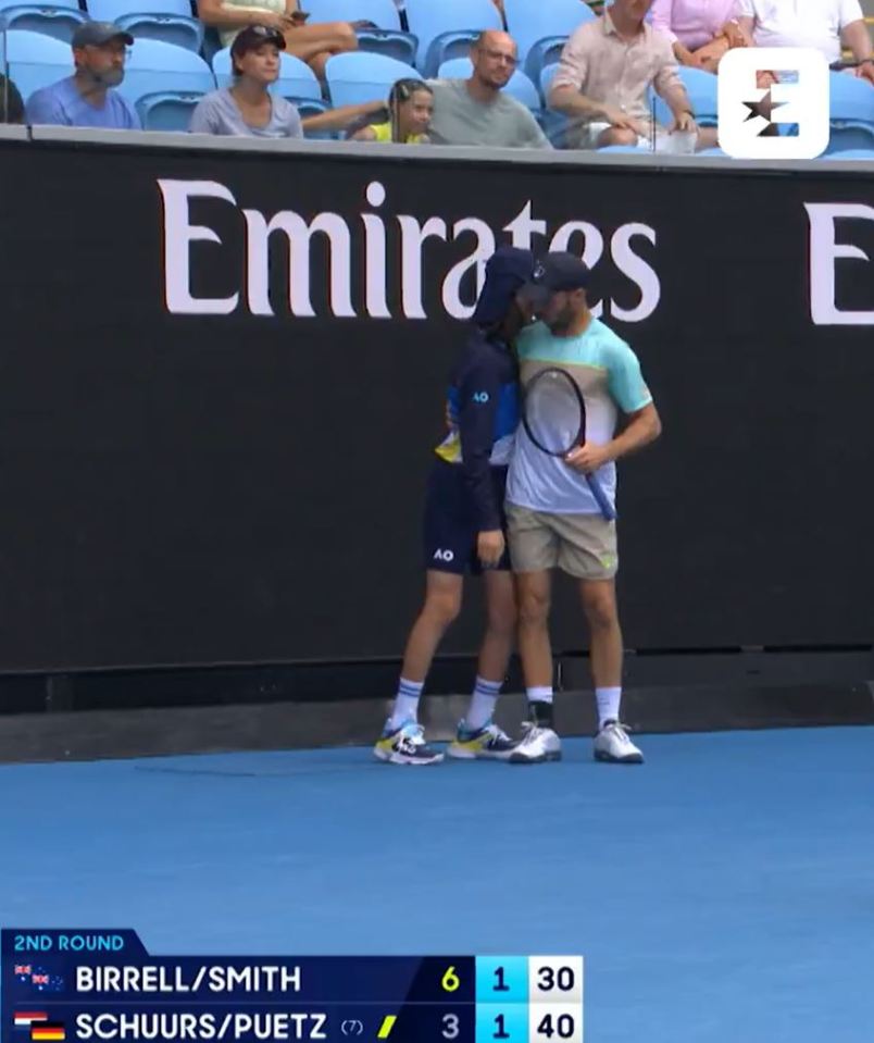 Tim Puetz comforting a ball kid.