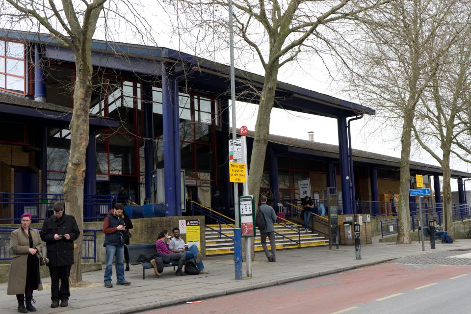 Oxford Train Station entrance with passengers waiting.