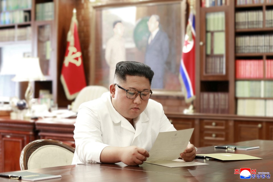 Kim Jong Un reading a letter.