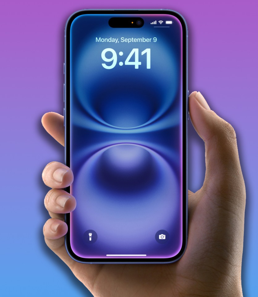 iPhone in hand showing the lock screen.