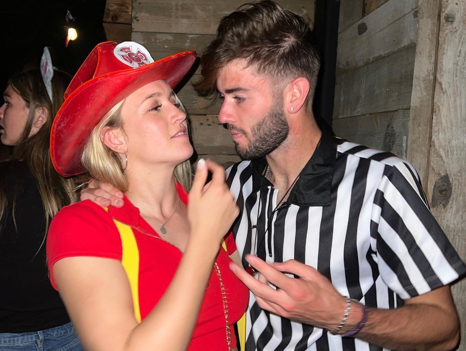 Woman in firefighter costume and man in referee costume.