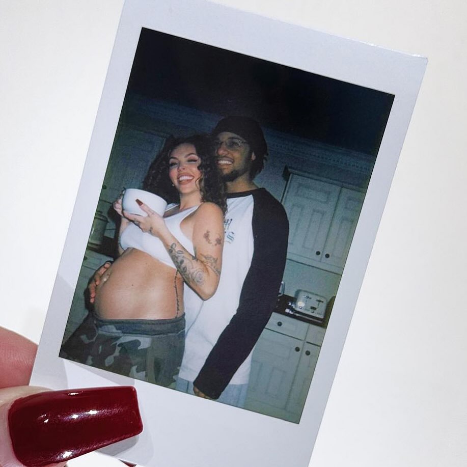 Polaroid photo of Jesy Nelson and her partner, showing her pregnant belly.