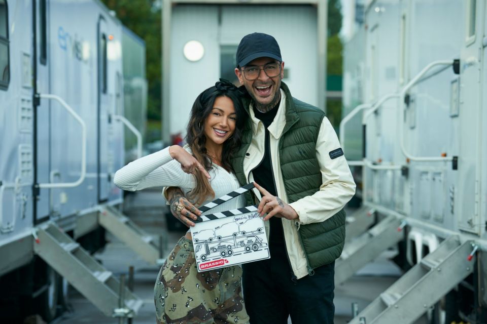 Joe Gilgun and Michelle Keegan holding a clapperboard for Brassic season 5.