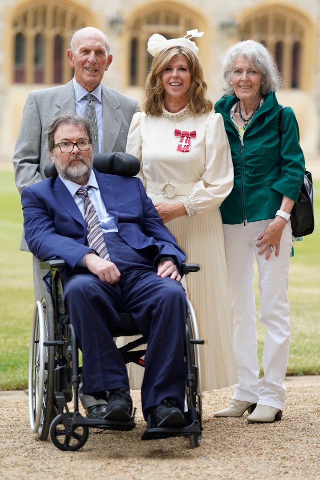 Kate Garraway with her husband Derek Draper, and her parents after receiving an MBE at Windsor Castle.