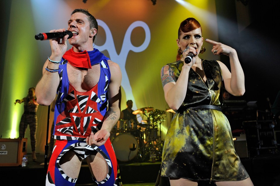 Jake Shears and Ana Matronic of the Scissor Sisters performing on stage.