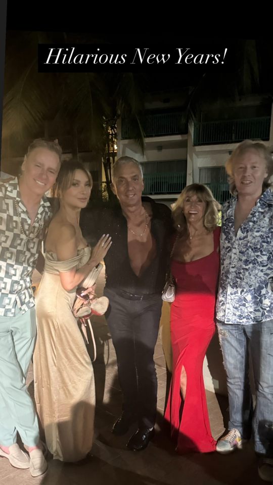 Group photo of five people at a New Year's Eve party.