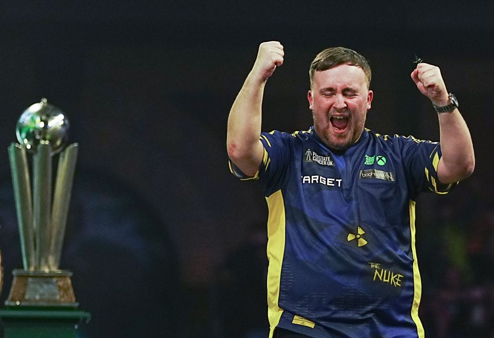 Luke Littler celebrates winning the PDC World Darts Championship.