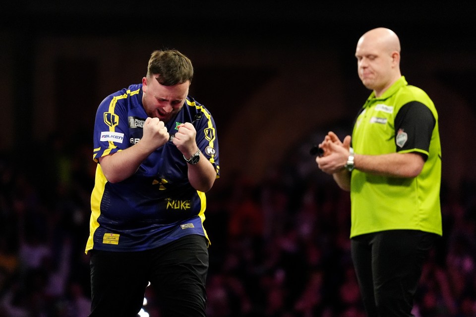 Luke Littler celebrates winning a darts championship.