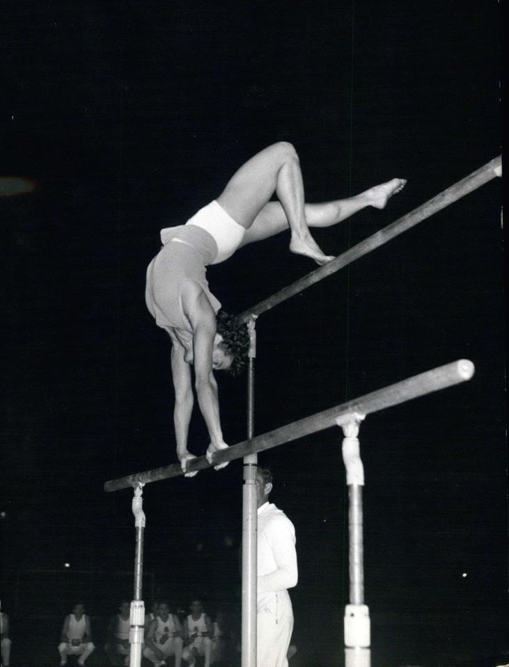 Larisa Latynina (center) of the USSR, Agnes Keleti of Hungary (left), and Sofi Mouratova of the USSR on the women's combined gymnastics awards podium.