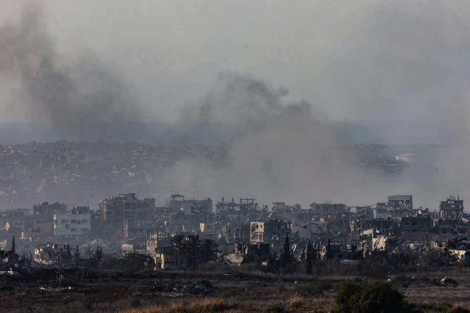Smoke rises over destroyed buildings in the northern Gaza Strip.