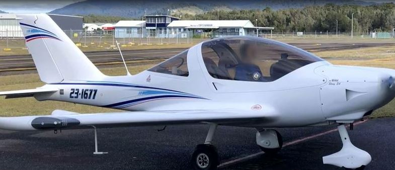 White single-engine aircraft, registration 23-1671.