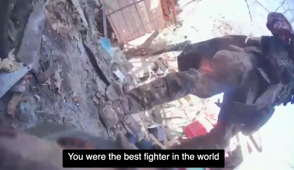 A wounded Ukrainian soldier surrenders to a Russian soldier after a knife fight.