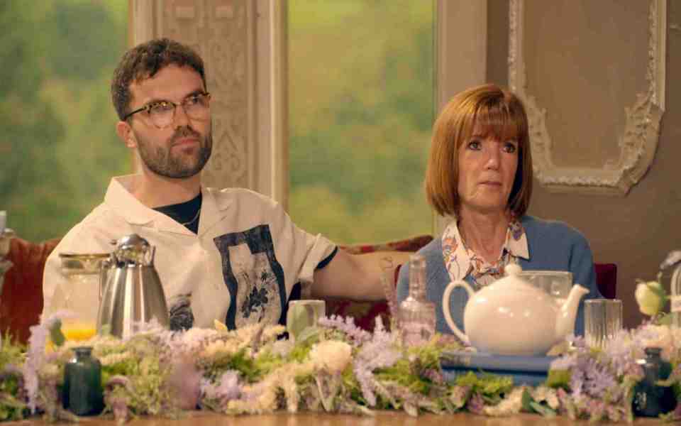 Two contestants on The Traitors react to news of a poisoning.