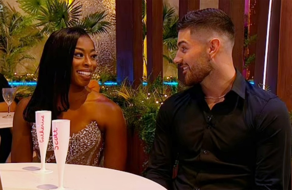 Love Island fans go wild for Catherine and Scott's chemistry while her ex Elom sits beside them - Love Island's Catherine Agbaje and Scott van-der-Sluis refused to deny a romance between the pair during the reunion show on Sunday night., , Catherine and Scott were a solid couple before this year's Casa Amor but she returned from her time apart from Scott with bombshell Elom Ahlijah-Wilson, leaving Scott fighting back tears and their union in tatters., , However, after Catherine and Elom decided to split and remain friends soon after they returned to the UK following their villa dumping last month, Scott and Catherine are said to have slid into each other's DMs.