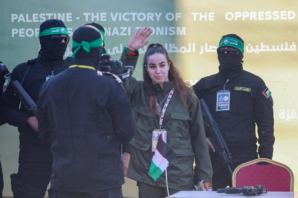 Released Israeli soldier holding certificate at Hamas event.