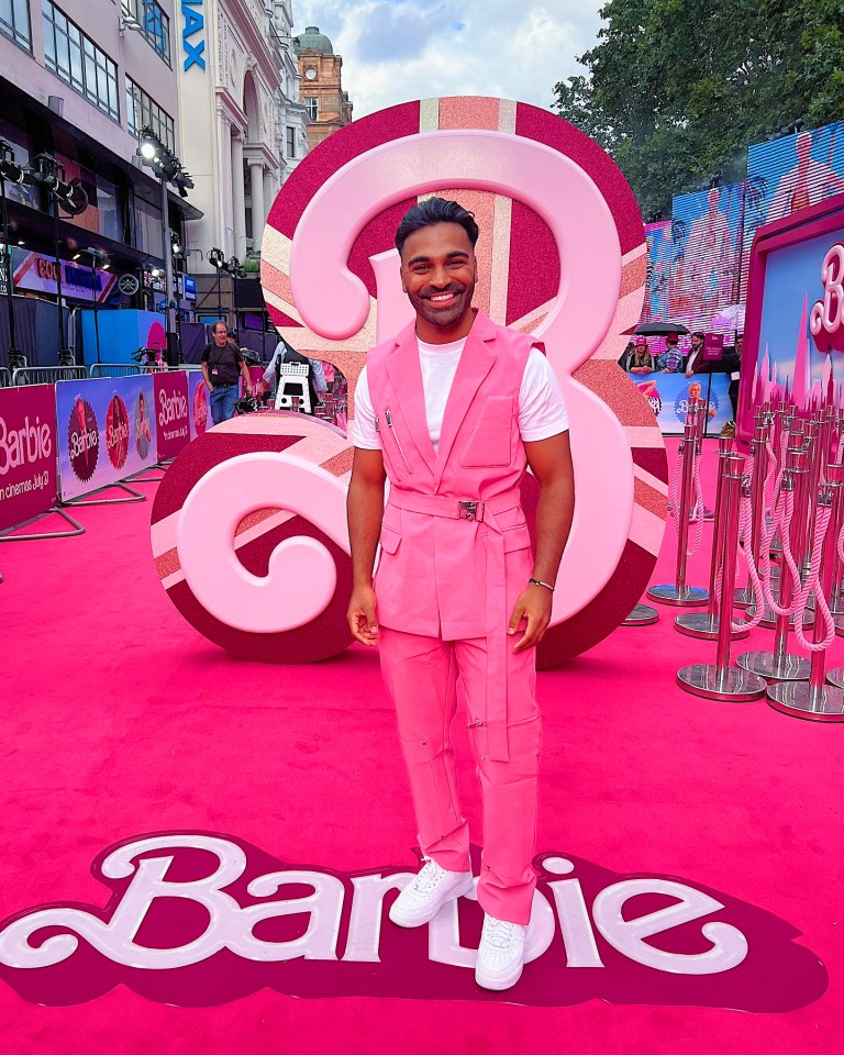 Man in pink suit at Barbie premiere.