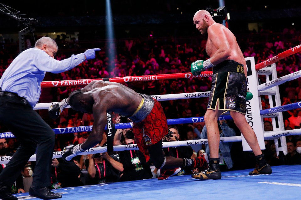 Tyson Fury knocks out Deontay Wilder in a boxing match.