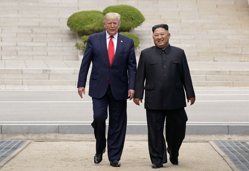 President Trump and Kim Jong Un walking together.
