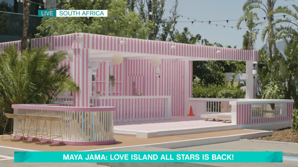 Love Island All Stars South Africa set: pink and white striped bar and lounge area.
