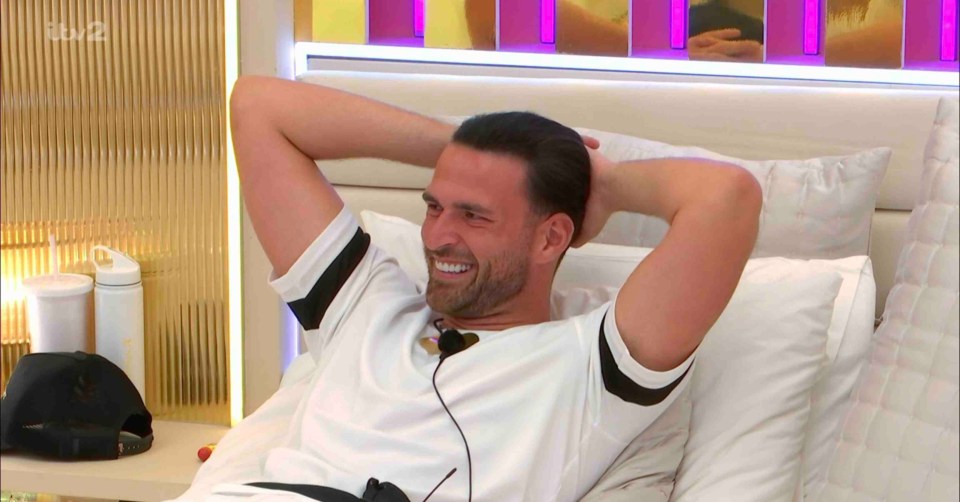 Curtis Pritchard smiling in bed.