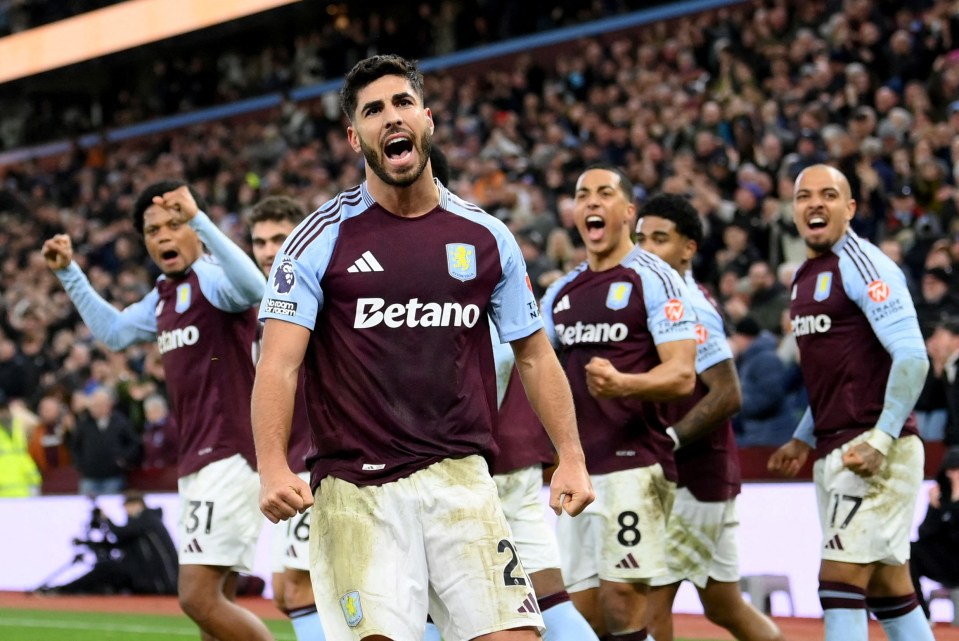 Aston Villa players celebrating a goal.
