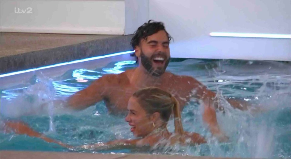 Casey O'Gorman and Gabby Allen in a pool celebrating.
