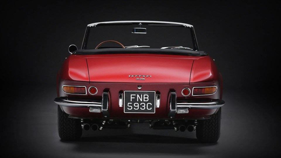 Rear view of a red 1965 Ferrari 275 GTS convertible.