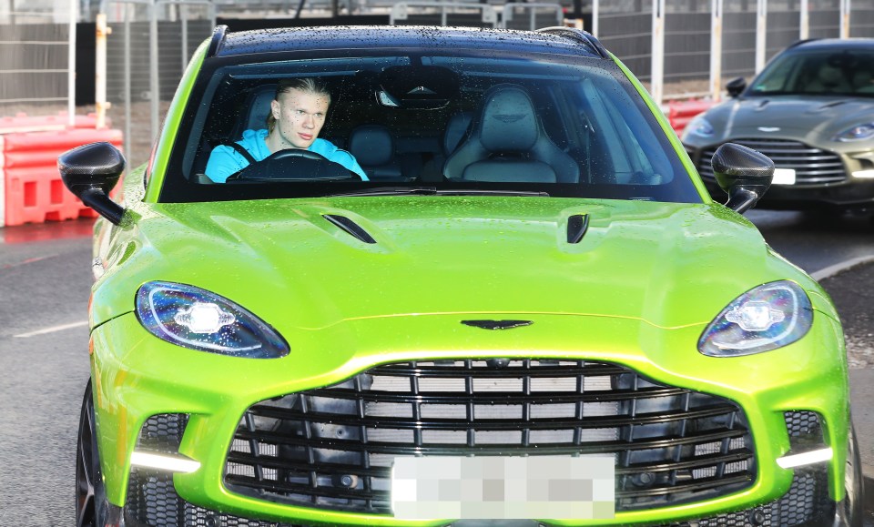 Erling Haaland driving a lime green Aston Martin.