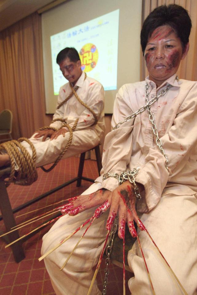 Demonstration of alleged Chinese government torture methods against Falun Gong practitioners.