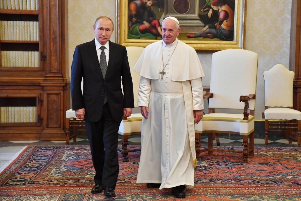 Pope Francis and Vladimir Putin leaving a private audience at the Vatican.