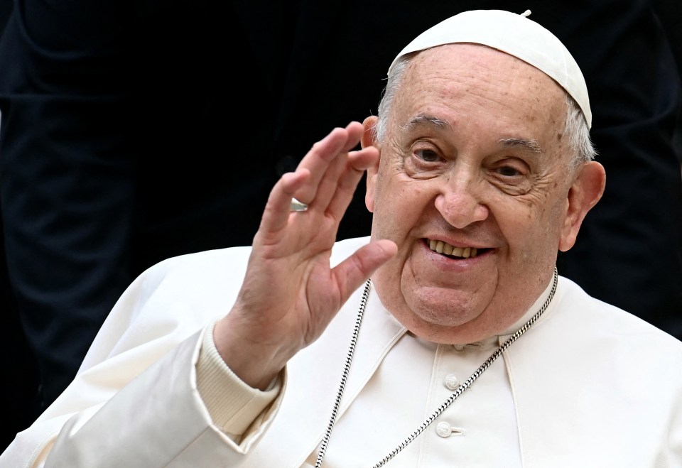 Pope Francis waving.