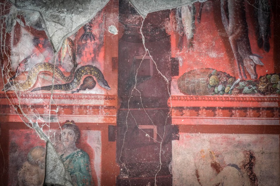Fresco of a banquet hall in Pompeii depicting food and figures.