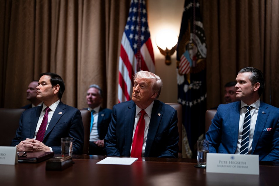 Donald Trump, Pete Hegseth, and Marco Rubio at a cabinet meeting.