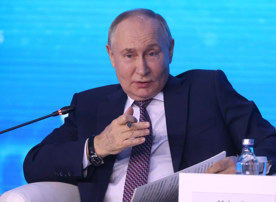 Vladimir Putin speaking at a forum.