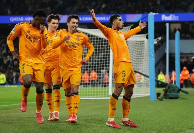 Real Madrid players celebrating a goal.