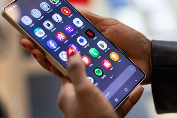 Person holding a Samsung Galaxy S25 Ultra smartphone.