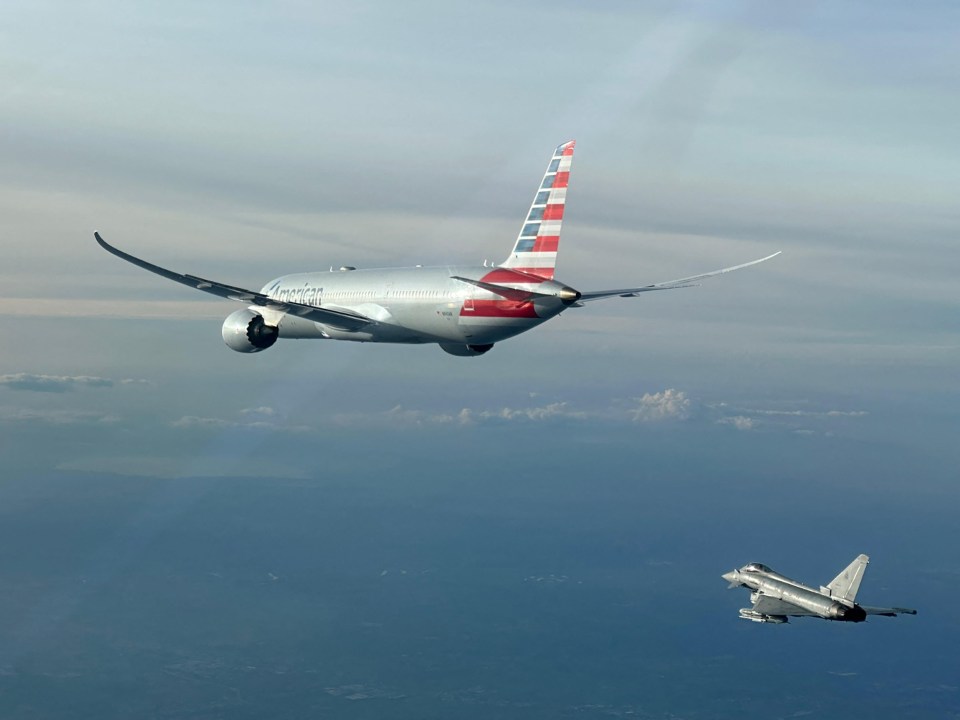 American Airlines flight escorted by Italian Air Force Eurofighter.