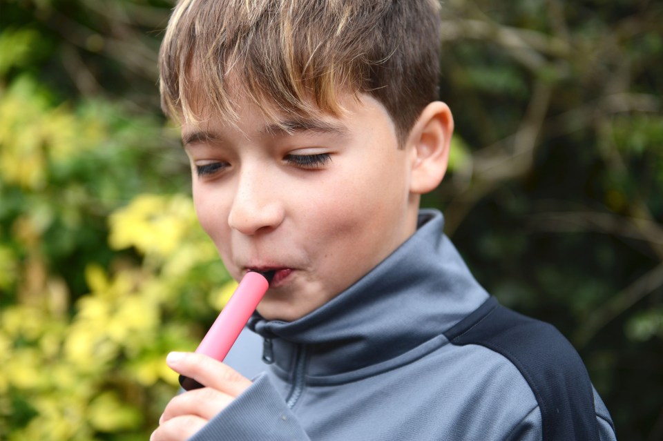 Schoolboy vaping.
