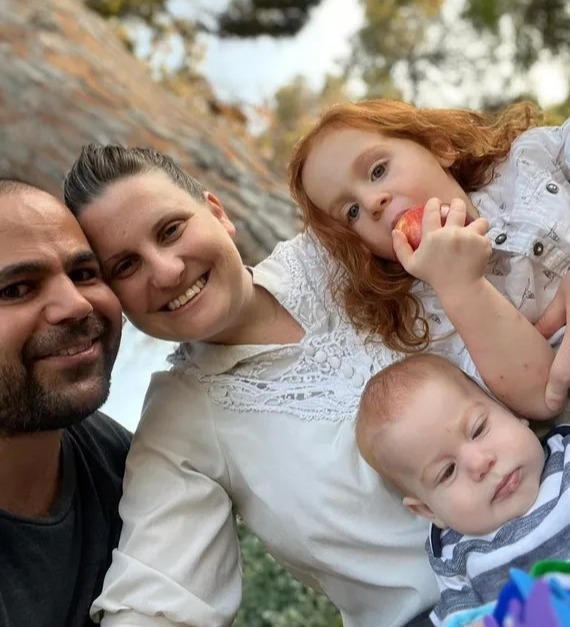 Family portrait outdoors.