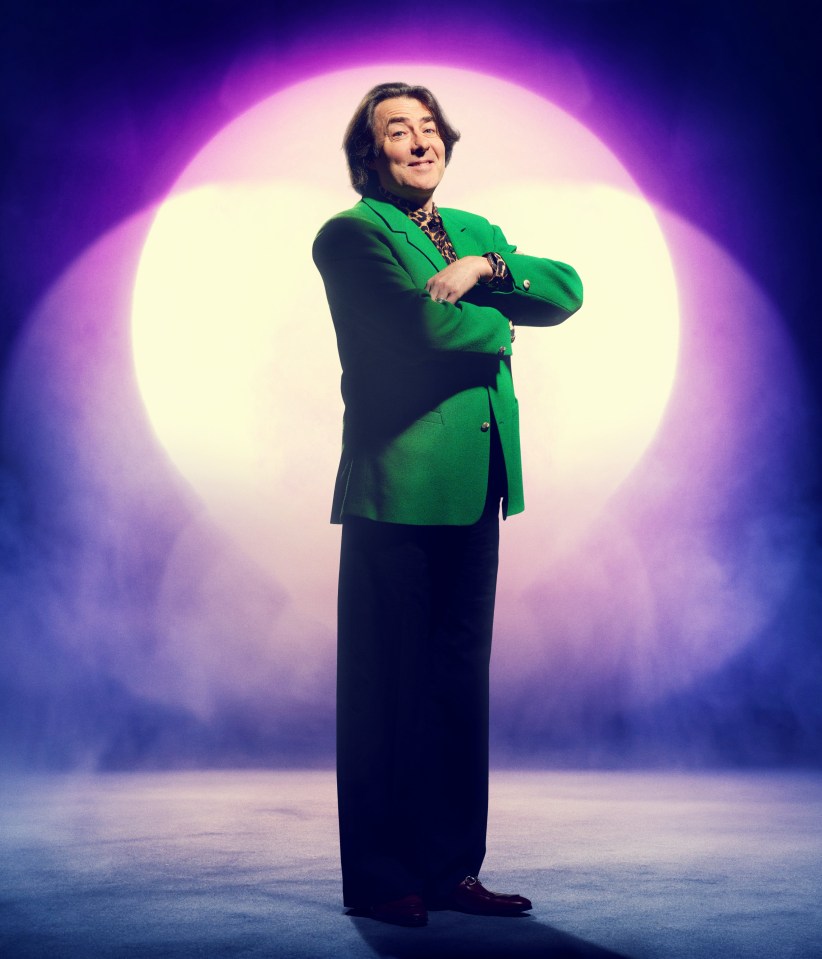 Jonathan Ross in a green jacket on The Masked Singer.