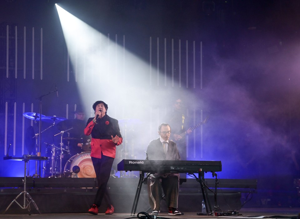 Sparks performing on stage at Glastonbury Festival.