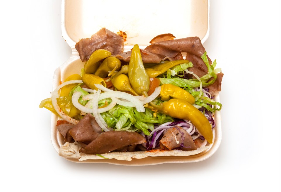 Lamb doner kebab in a takeout container.