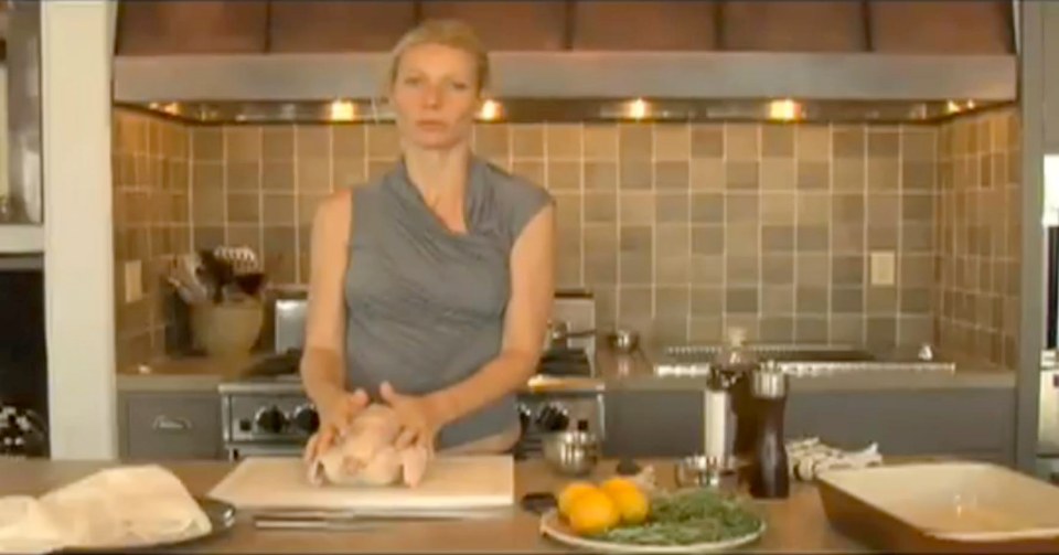 Gwyneth Paltrow preparing a roast chicken in a cooking class.