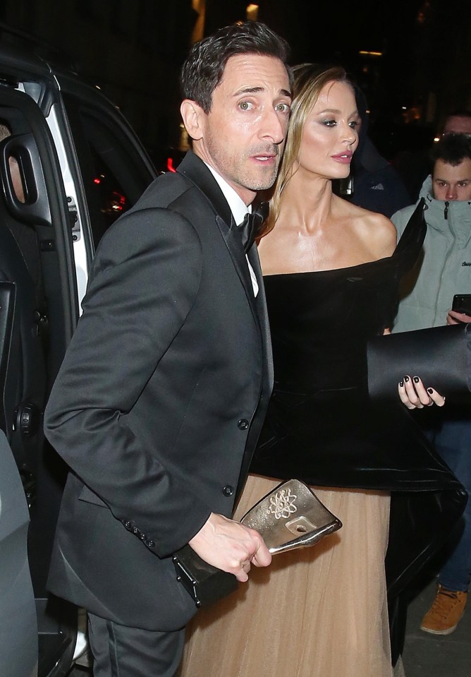 Adrien Brody along with Georgina Chapman celebrates his win at the 2025 BAFTA Awards for his role as Leading Actor in 'The Brutalist'. Adrien Brody was seen arriving with Georgina proudly holding his BAFTA award at Tramp club in London for The British Vogue x GQ BAFTA Party. Pictured: adrien brody,georgina chapman Ref: BLU_S8174936 170225 NON-EXCLUSIVE Picture by: WP Pix / SplashNews.com Splash News and Pictures USA: 310-525-5808 UK: 020 8126 1009 eamteam@shutterstock.com World Rights