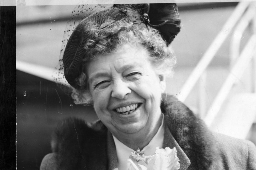 Black and white photo of Eleanor Roosevelt smiling.